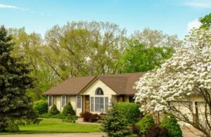 ranch-style home in Columbia, Missouri, surrounded by trees