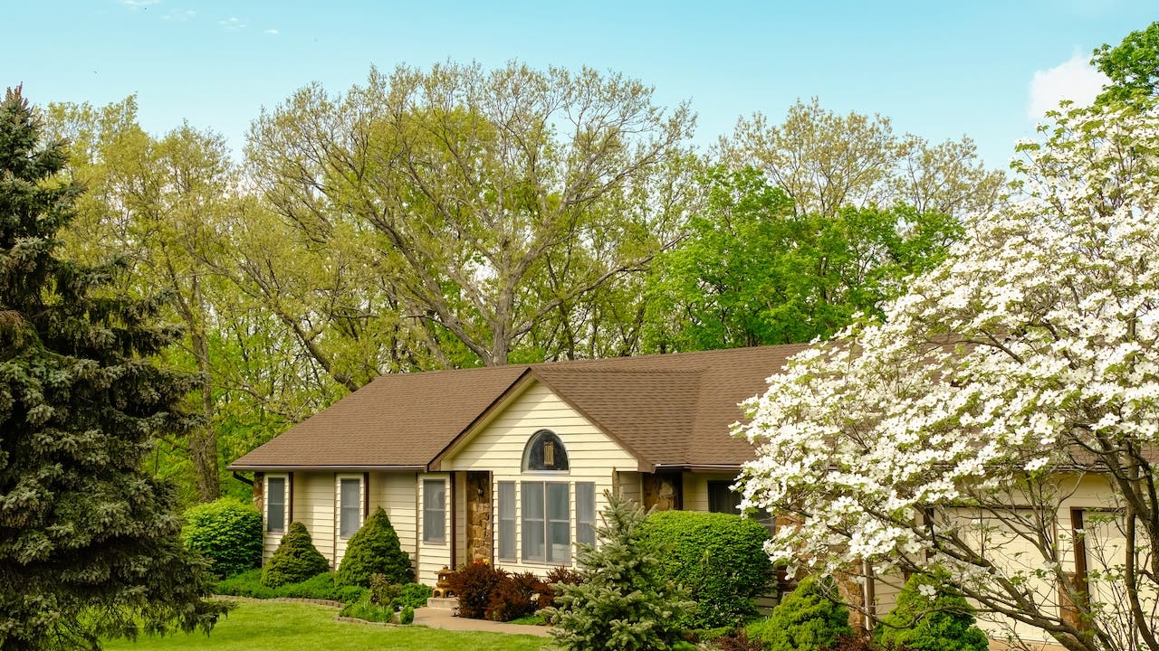 ranch-style home in Columbia, Missouri, surrounded by trees