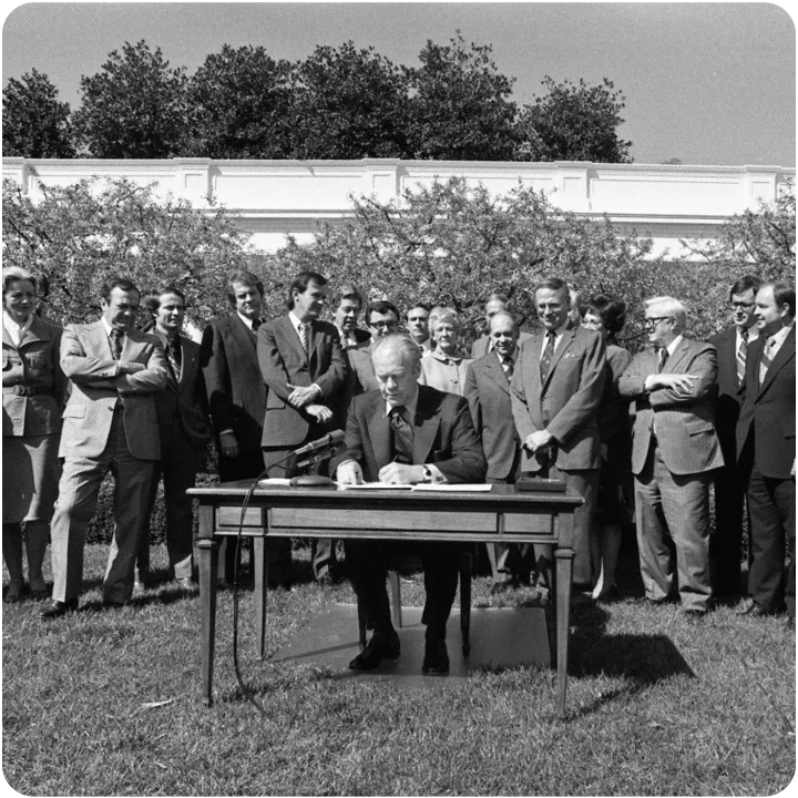 President Gerald Ford signing the ECOA