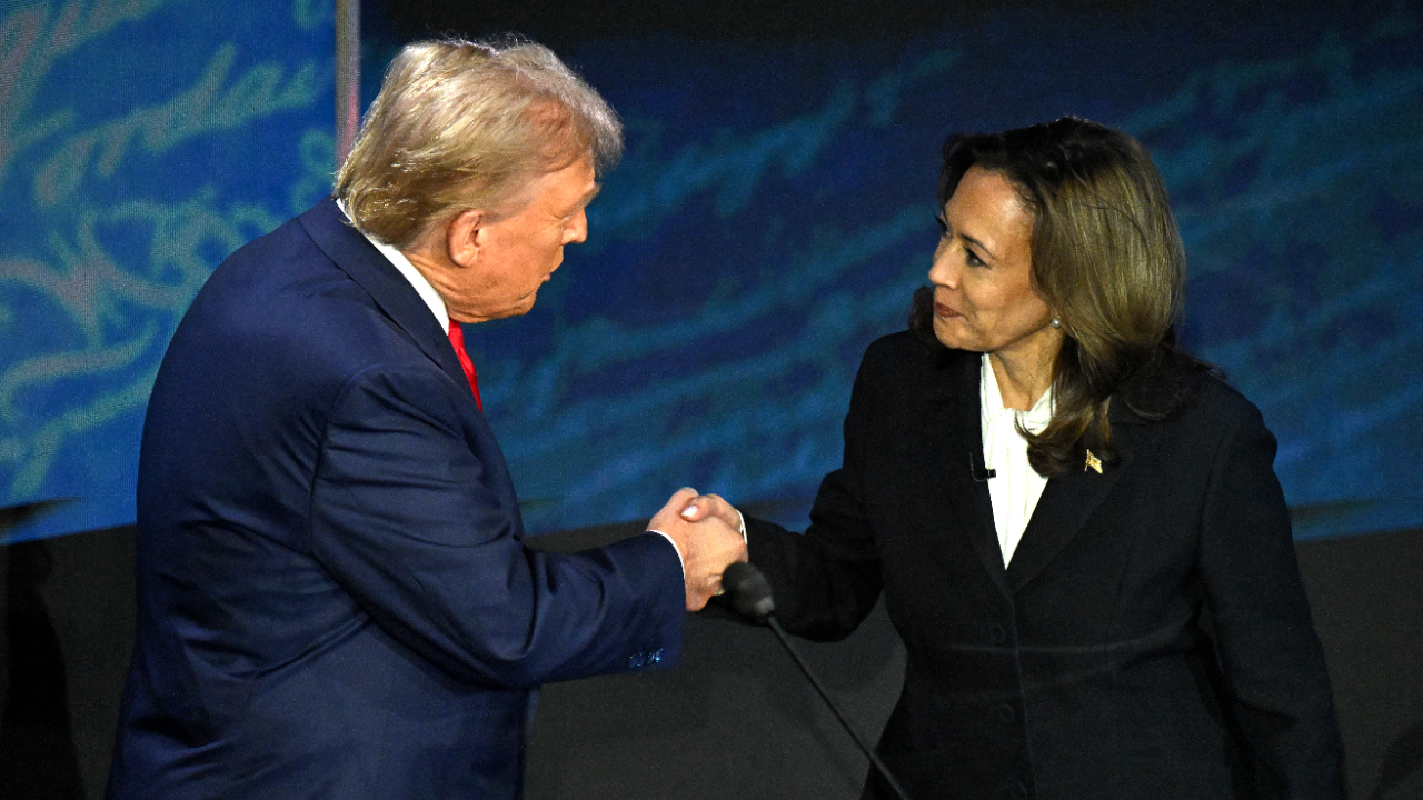 US Vice President and Democratic presidential candidate Kamala Harris shakes hands with former US President and Republican presidential candidate Donald Trump during a presidential debate.