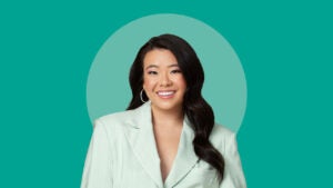 Personal finance influencer Vivian Tu wearing a light green suit