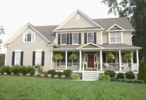 Cream-colored suburban house with large front porch