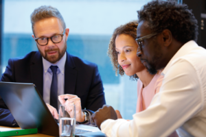 Financial advisor having a meeting with clients - stock photo