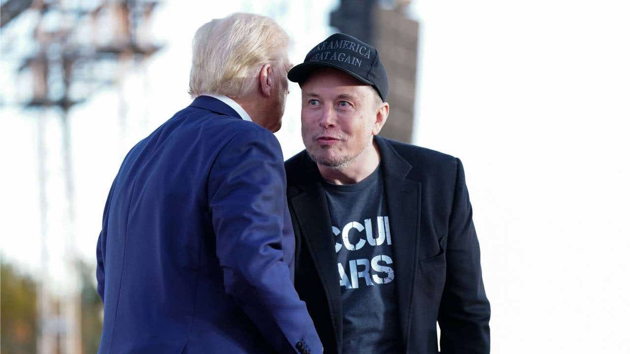 Elon Musk speaks with former president Donald Trump during a campaign event at the Butler Farm Show, Saturday, Oct. 5, 2024, in Butler, Pa.