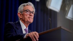 Fed Chair Jerome Powell speaks from a podium