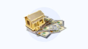 Image of a house sitting atop money