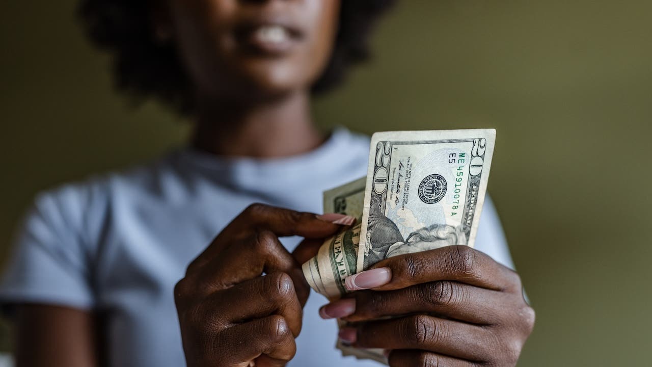 Close up of a woman counting money