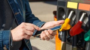 Refueling a car and paying using smartphone.