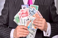 Businessman holding a selection of banknotes