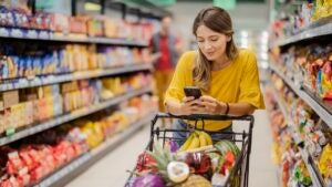 Woman on her phone in a grocery store