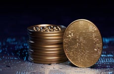 A stack of golden coins representing crypto tokens.