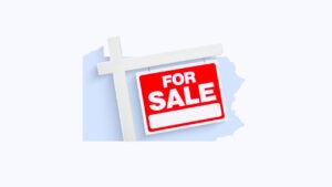 photo illustration of a home's for sale sign with the shape of pennsylvania