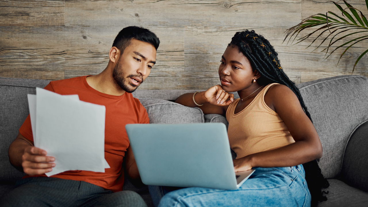 Young couple figuring out their finances.