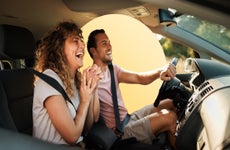 Couple driving in car