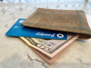 Freedom Flex card in a wallet with money