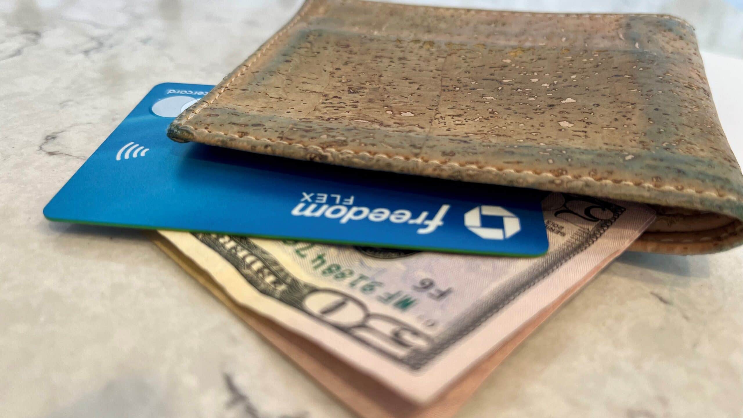 Freedom Flex card in a wallet with money