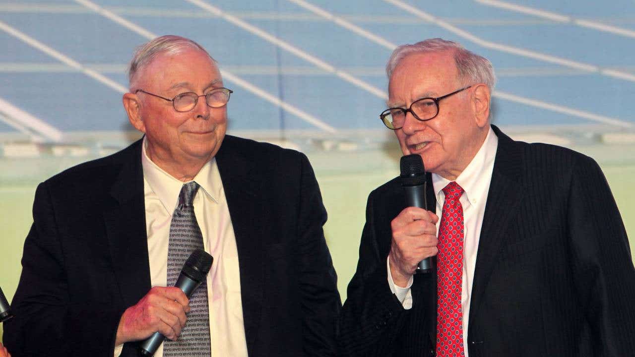 Berkshire Hathaway CEO Warren E. Buffett and Charles Munger attend a new product launching conference of BYD at China World Hotel on Sept. 29, 2010 in Beijing, China.