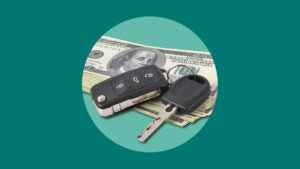 An image of a car key and fob placed over a stack of $100 USD bills. Surrounding it is a light green circle over a dark green background.