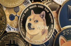 Illustration of several crypto tokens with a Dogecoin token occupying a prominent place.