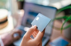 Woman paying with a debit card