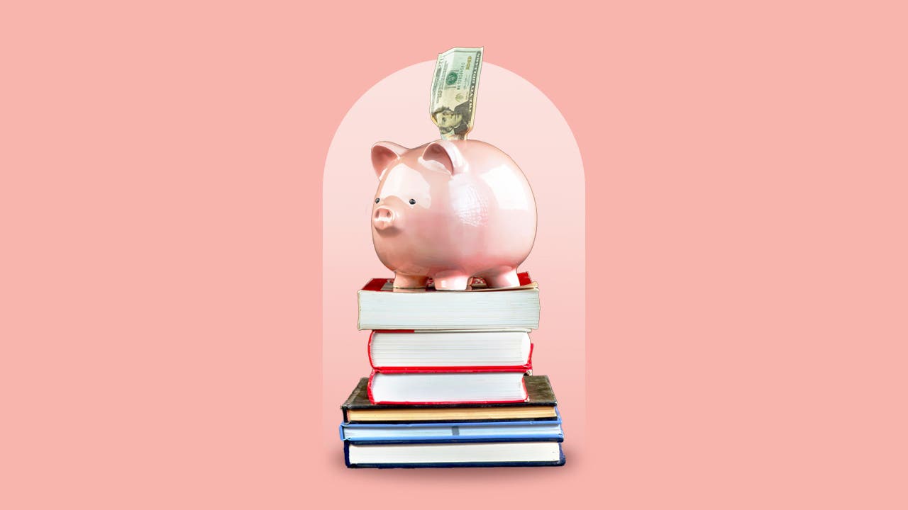 A piggy bank on a stack of books