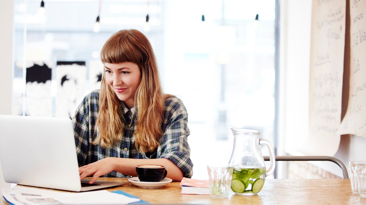 woman using computer in a coffee shop