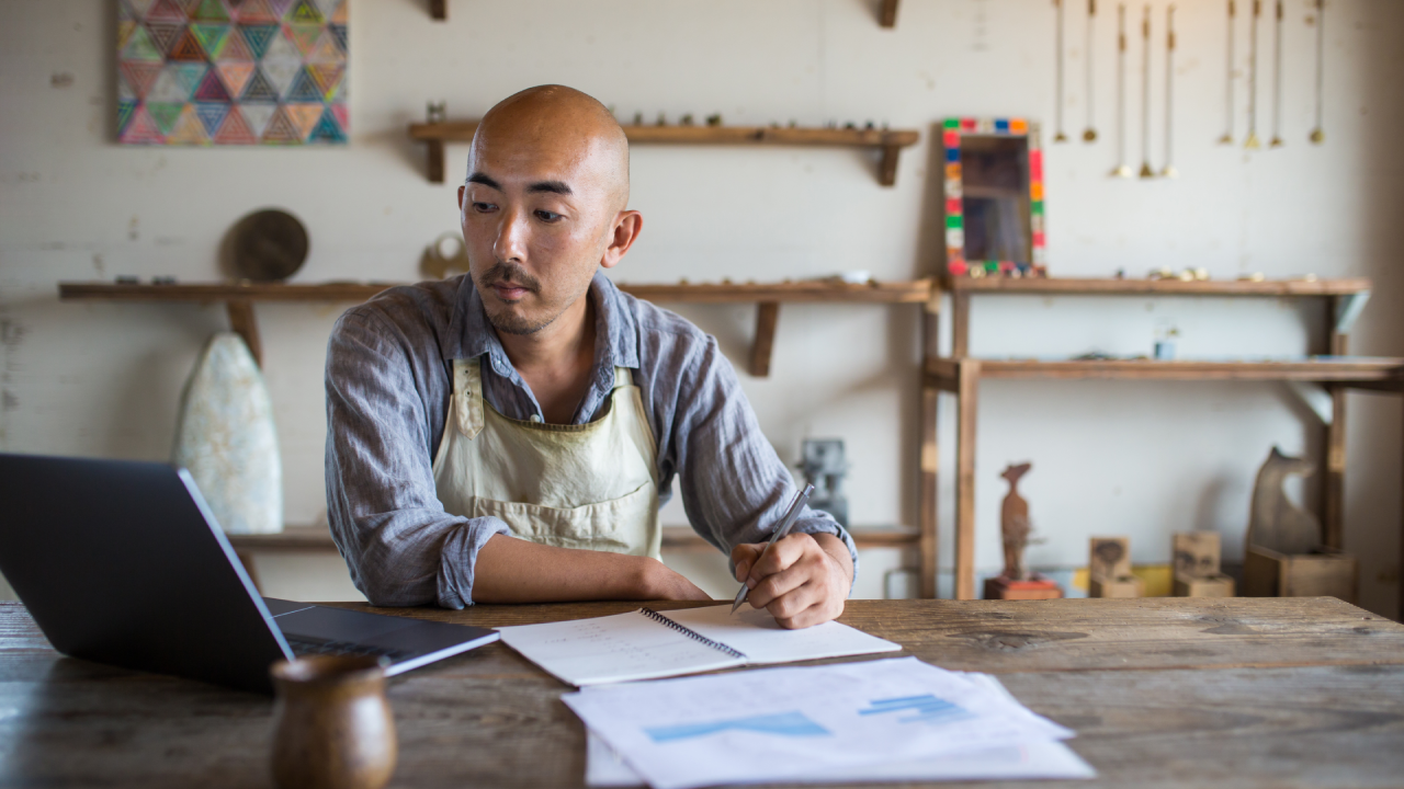 man sitting with business paperwork