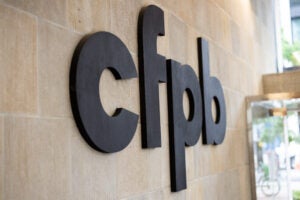 A picture of the side of the Consumer Financial Protection Building, showing the CFPB logo