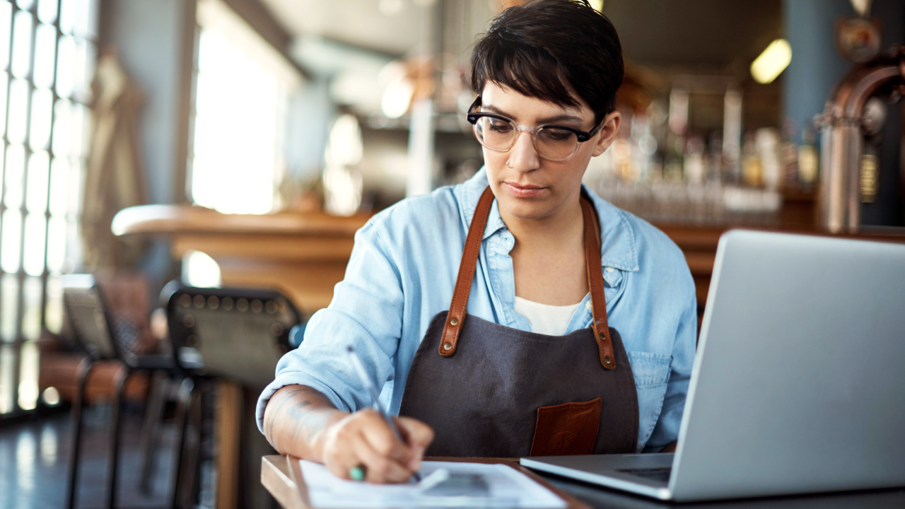 A woman managing business checking paperwork.