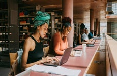 People studying in a university library.