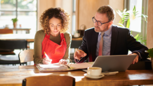 A business owner and a CPA going over tax paperwork.