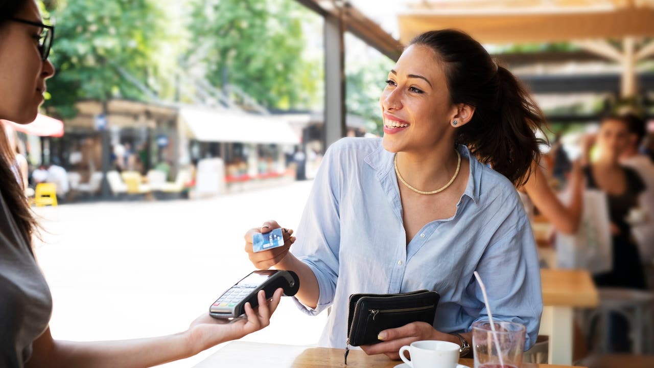 Woman making card payment.