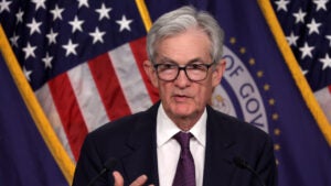 Fed chair Jerome Powell speaks to reporters at a Fed meeting