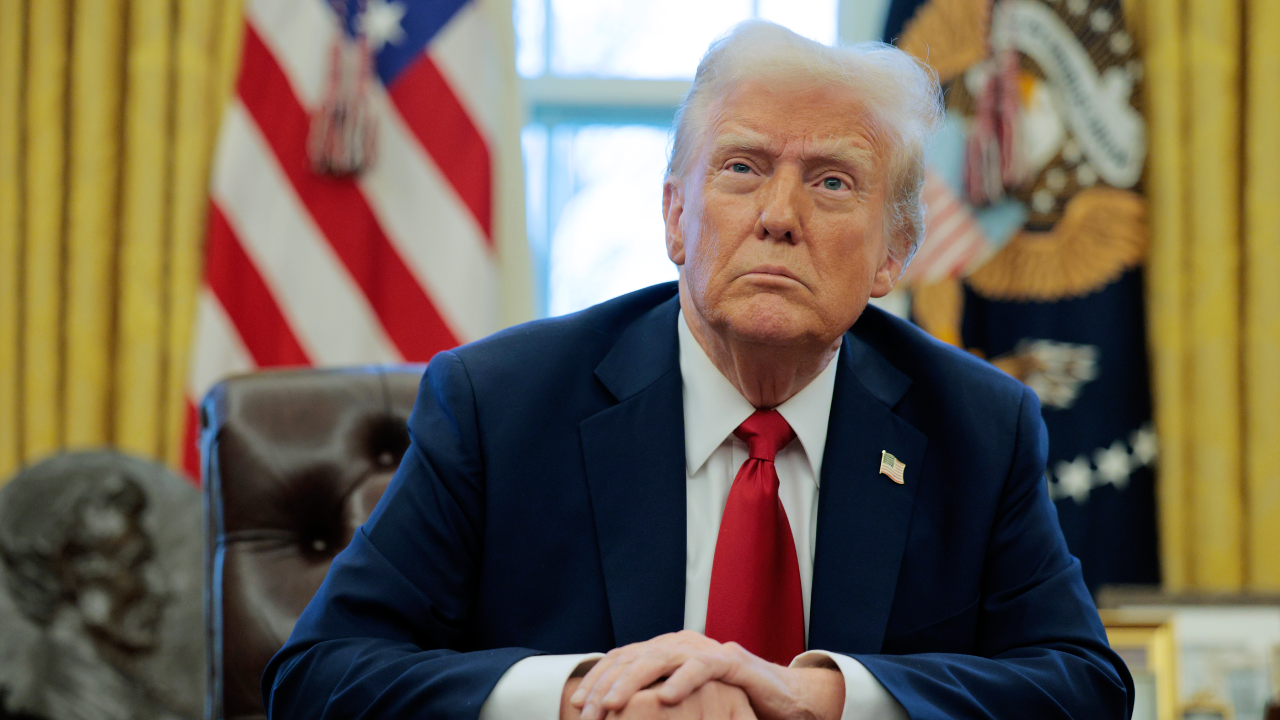 President Donald Trump sitting in the Oval Office.