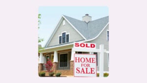 house with brick front porch and sold sign out front