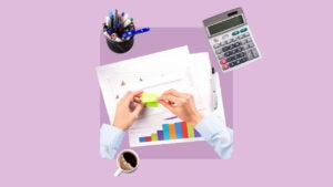 A closeup of hands as the person peels a sticky note while surrounded by other common office supplies. Design is on top of a light purple background.