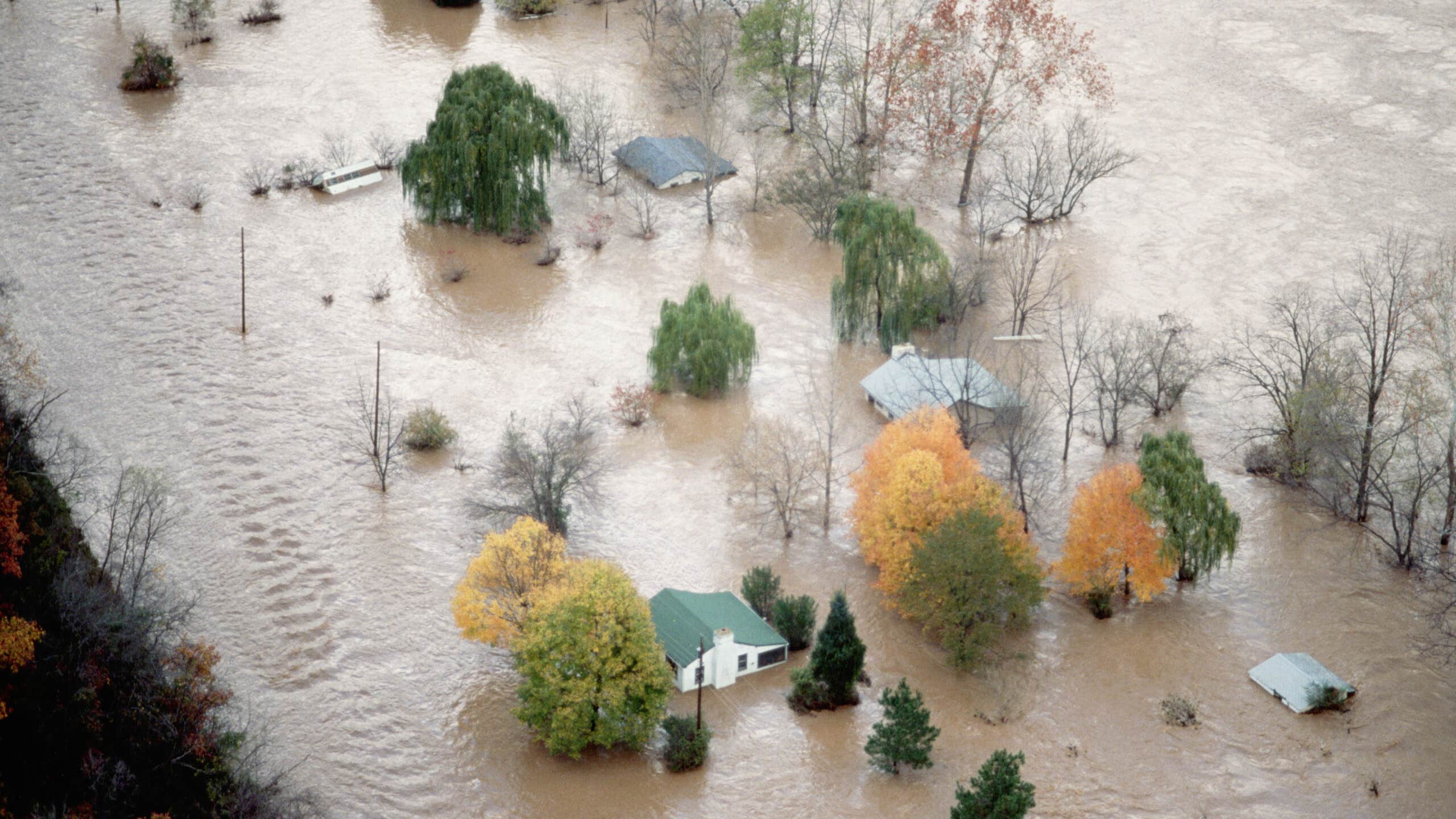 homes and trees in flooded valley