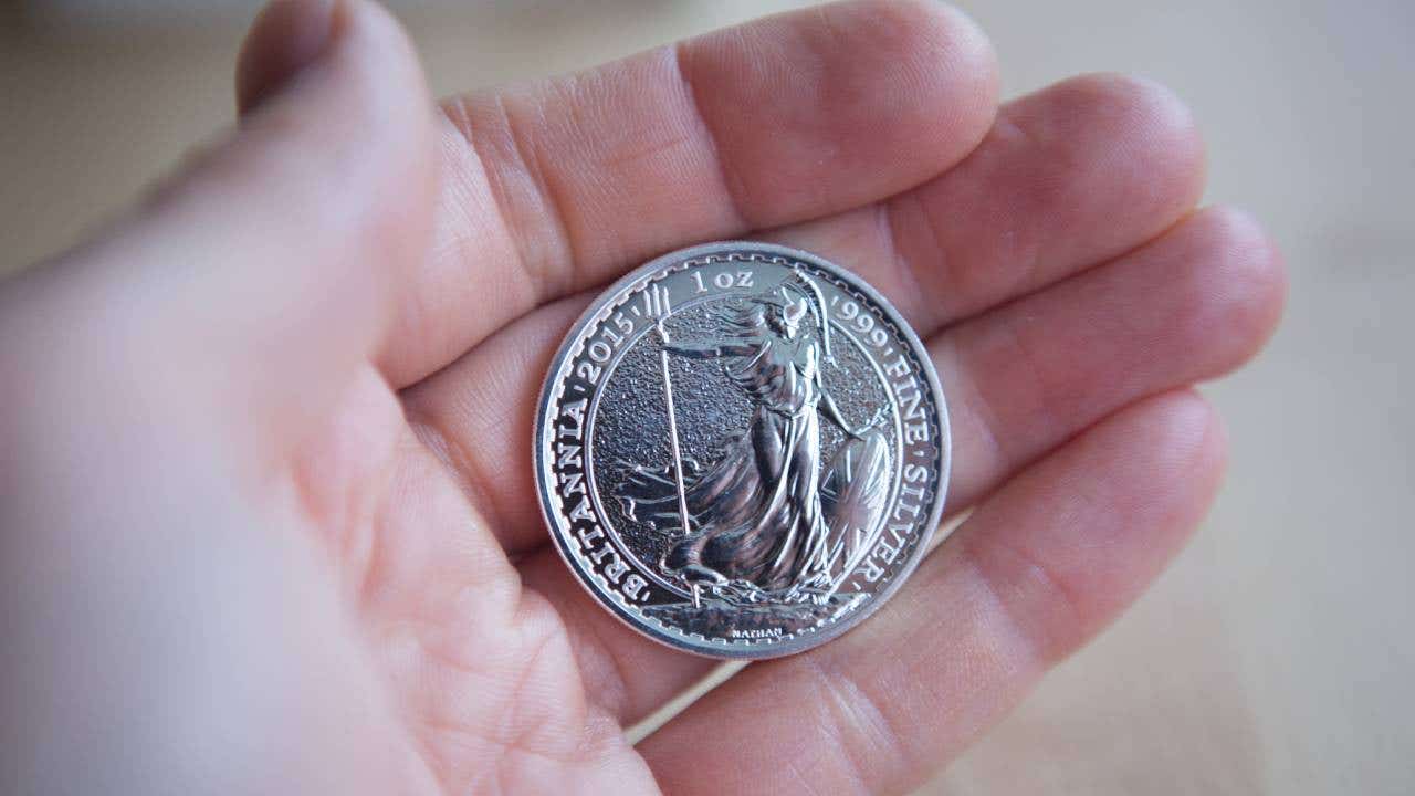 Britannia 1 Ounce Silver Coin held in hand.