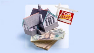 Design element of a home with a "sold" sign on top of a pile of cash