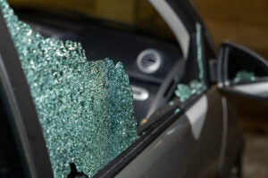 closeup of front window of vehicle shattered